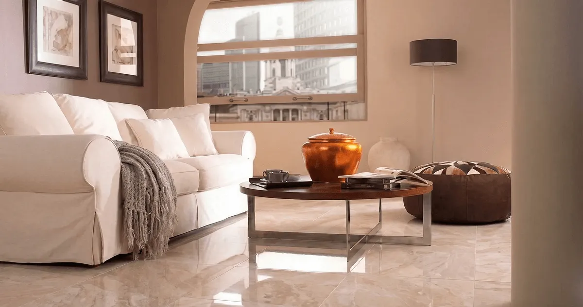 Modern living room with professionally installed marble flooring, a beige sofa, coffee table in Portland, OR
